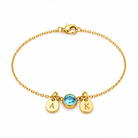 armband met maandsteen rond bedels  met letter a december en K