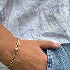 Minimalistische gouden schakelarmband met zirconia